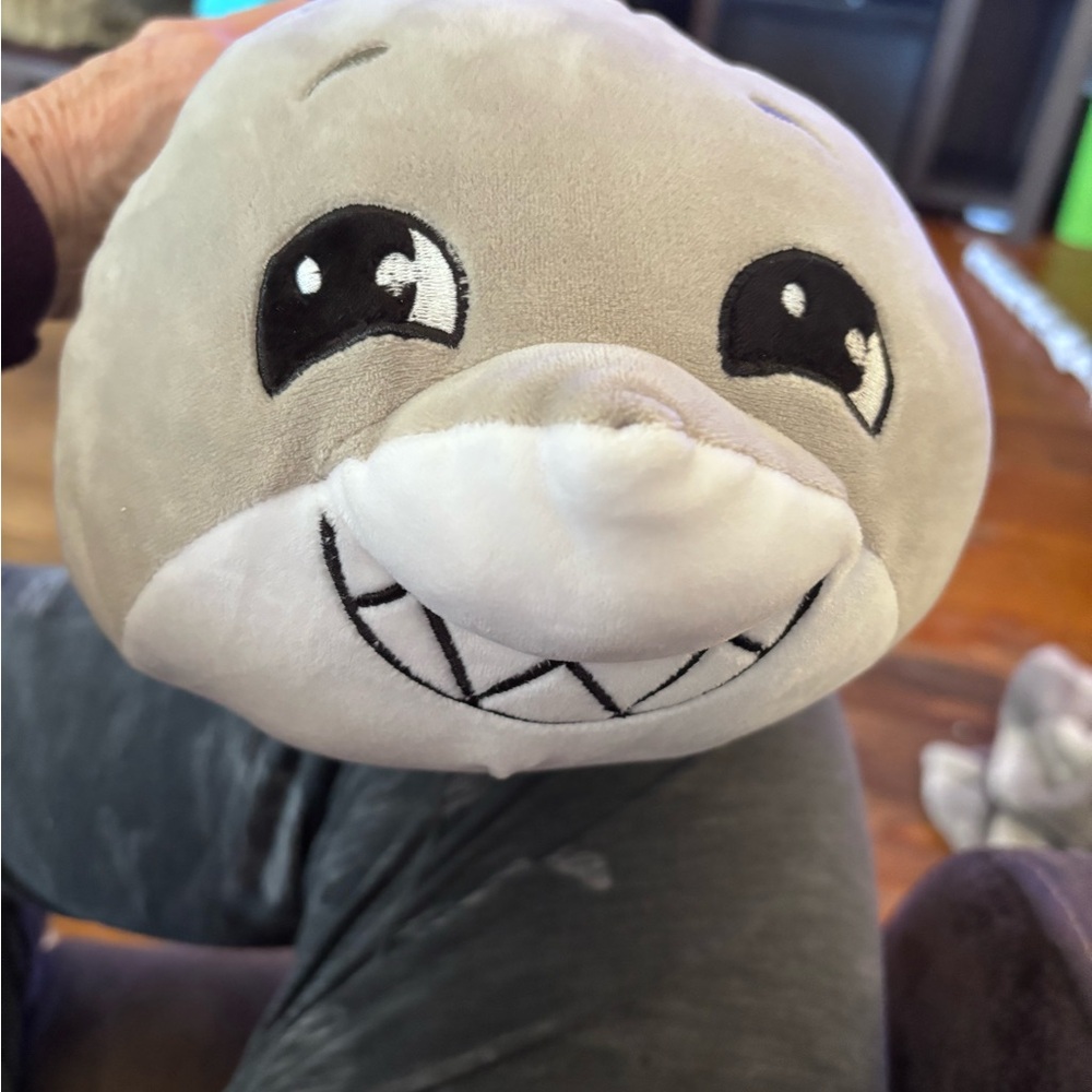 Charming Gray Plush Creature with Expressive Eyes